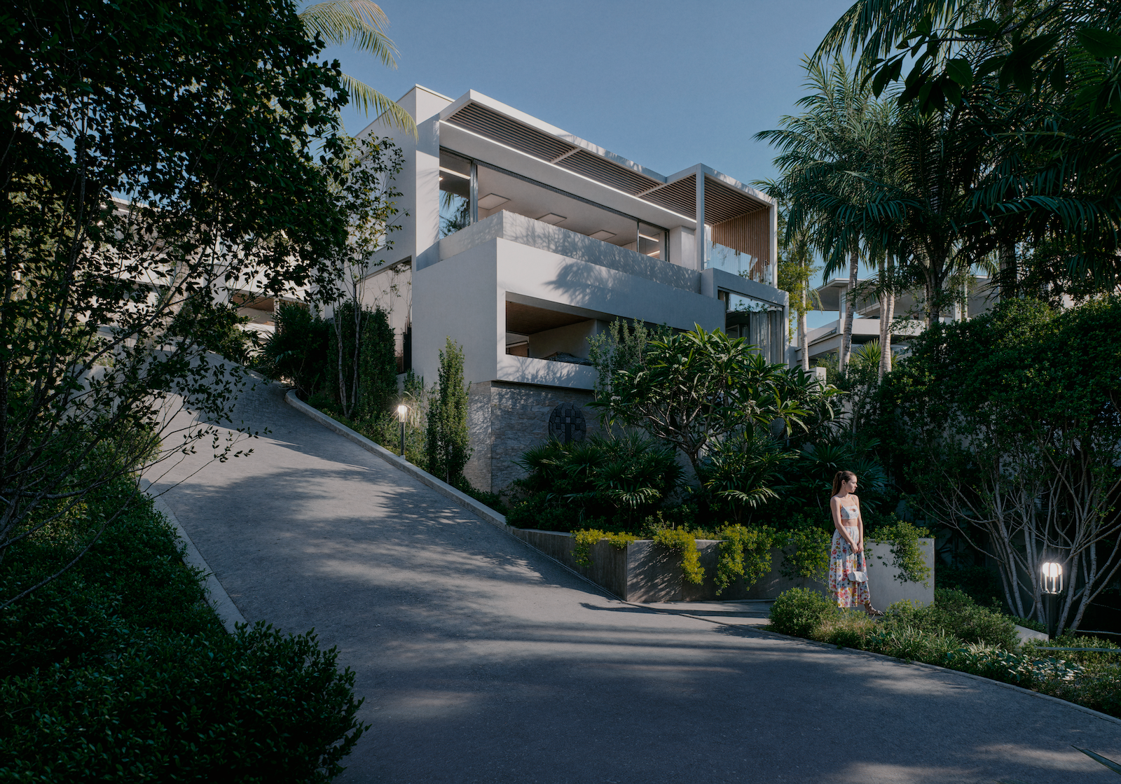 IO Villas — entrance driveway with lush gardens