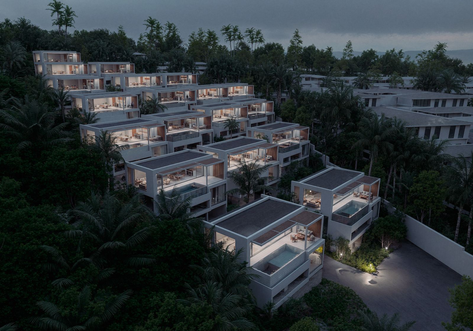 IO Villas — wide aerial night view of the complex