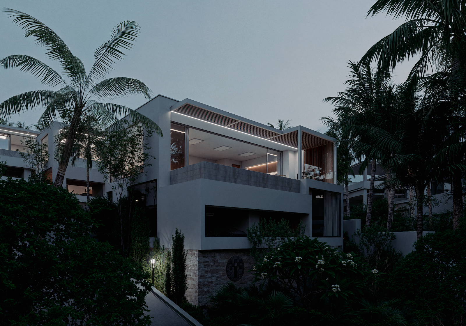 IO Villas — street view between villas with landscaping at dusk