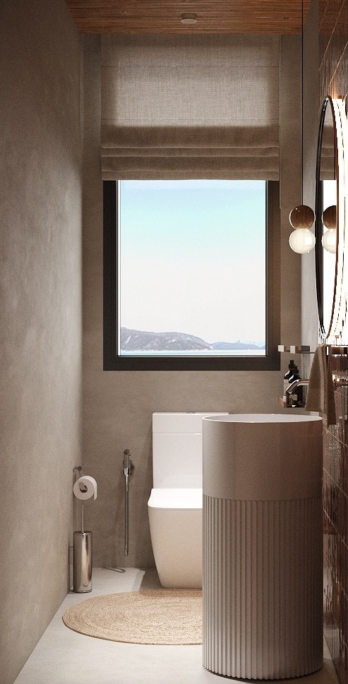 IO Villas — Guest Bathroom: ocean-view window with fluted pedestal sink and terracotta tile wall